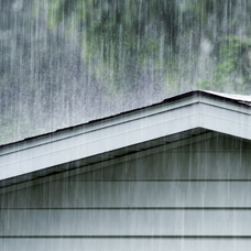 Rain pouring on a roof.